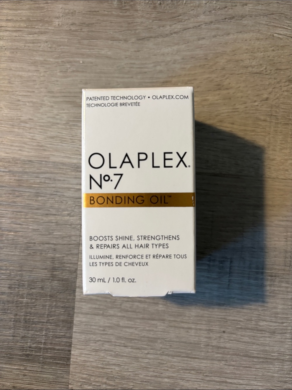 OLAPLEX No.7 Bonding Oil — White & Gold Accent